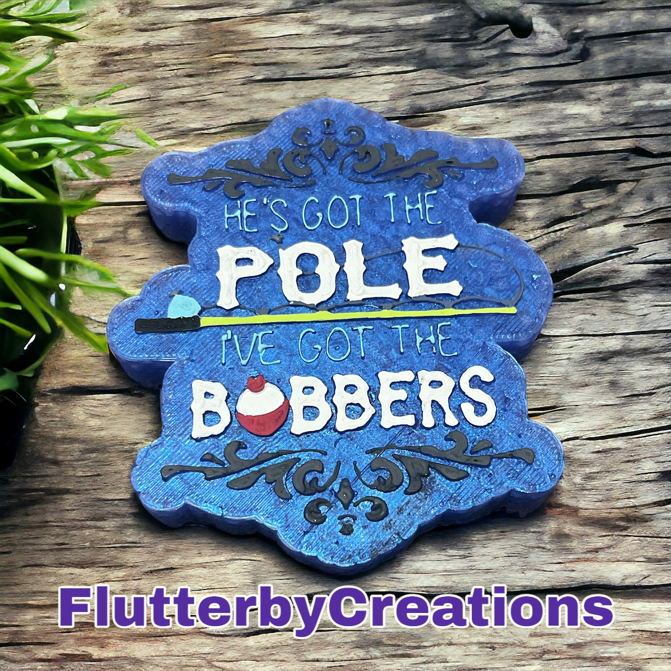 a blue sign that says he's got the pole we got the bobbers