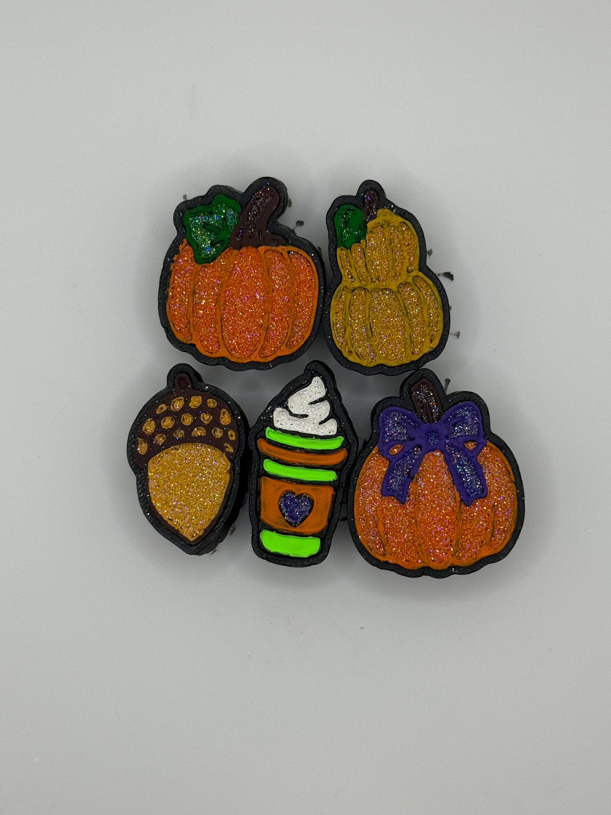 Fall Charmie Set flat lay: pumpkins, fall drink cup, and acorn