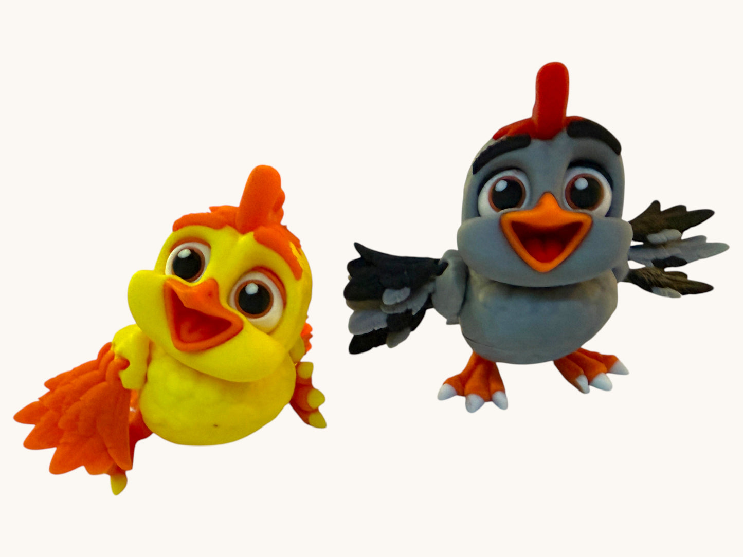 Flutterby Creations yellow and orange 3D printed chick figurine with large eyes and fluffy tail.