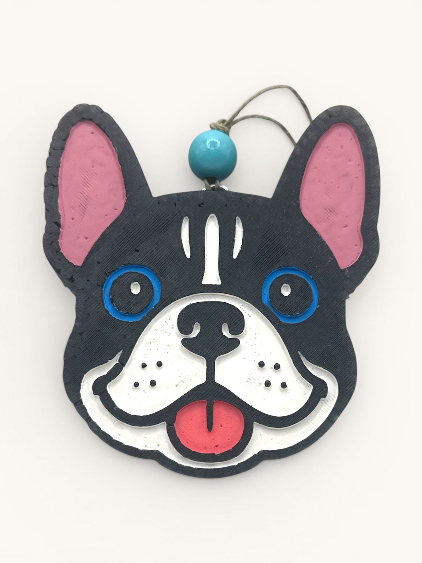Flutterby Creations French bulldog car freshie with black, white, blue, and pink details. Features a blue bead and hanging string.