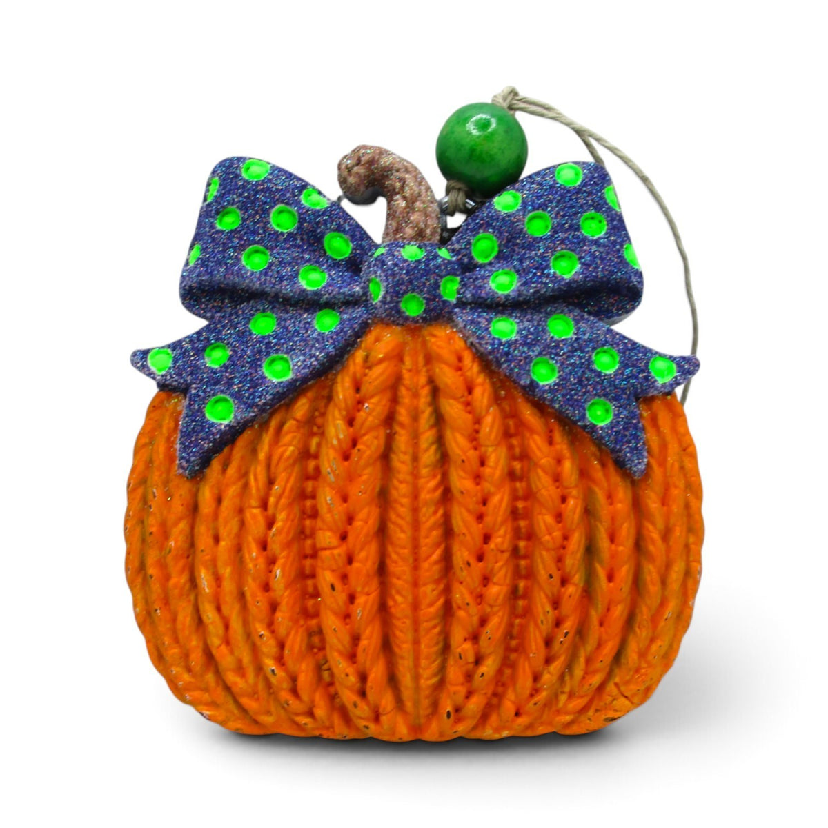 Flutterby Creations 3D knitted pumpkin car freshie with a purple and green polka dot bow and green bead accent.