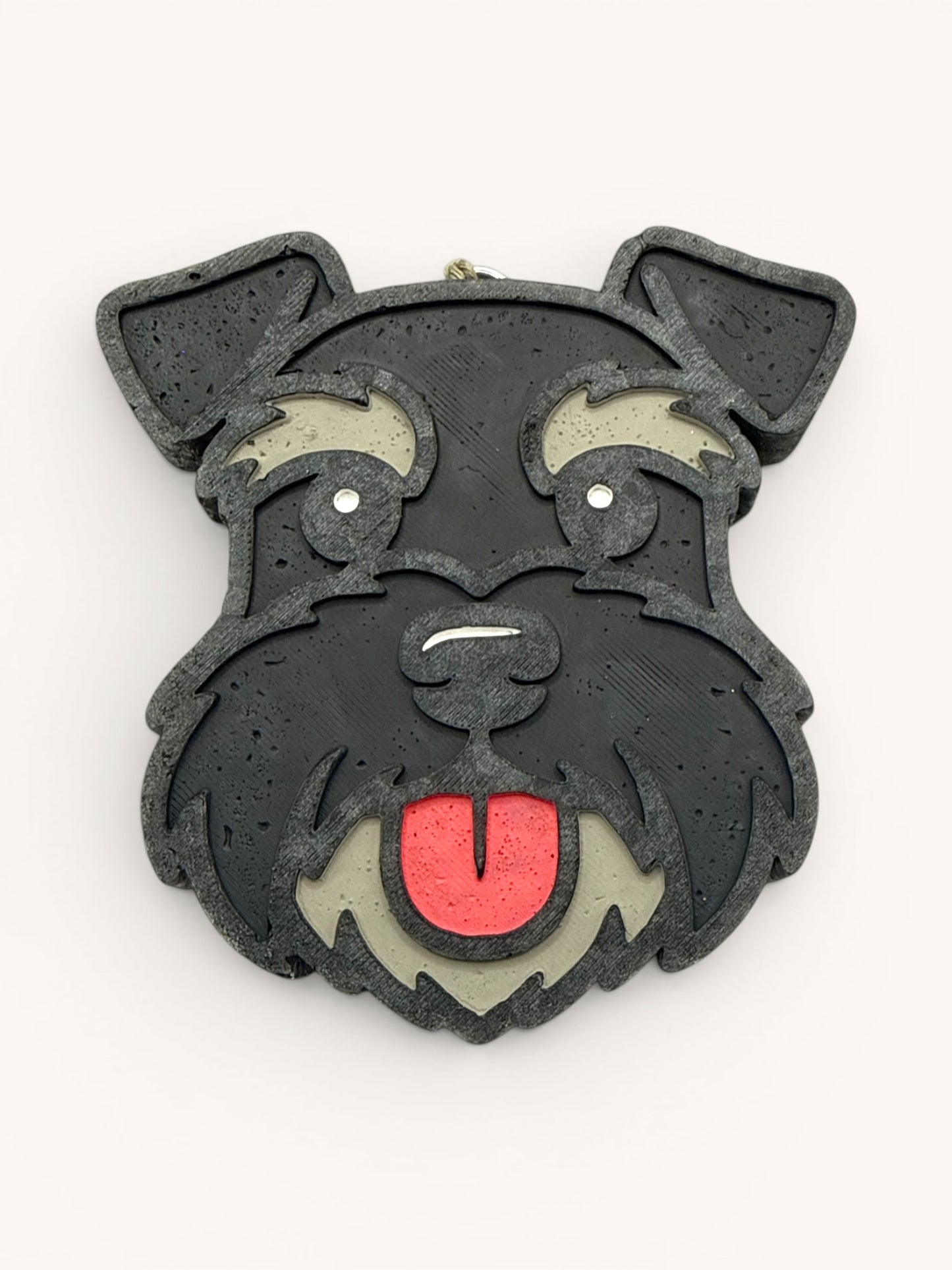 Flutterby Creations Schnauzer Style car air freshener, black with grey and red accents, featuring a schnauzer dog face with tongue out.