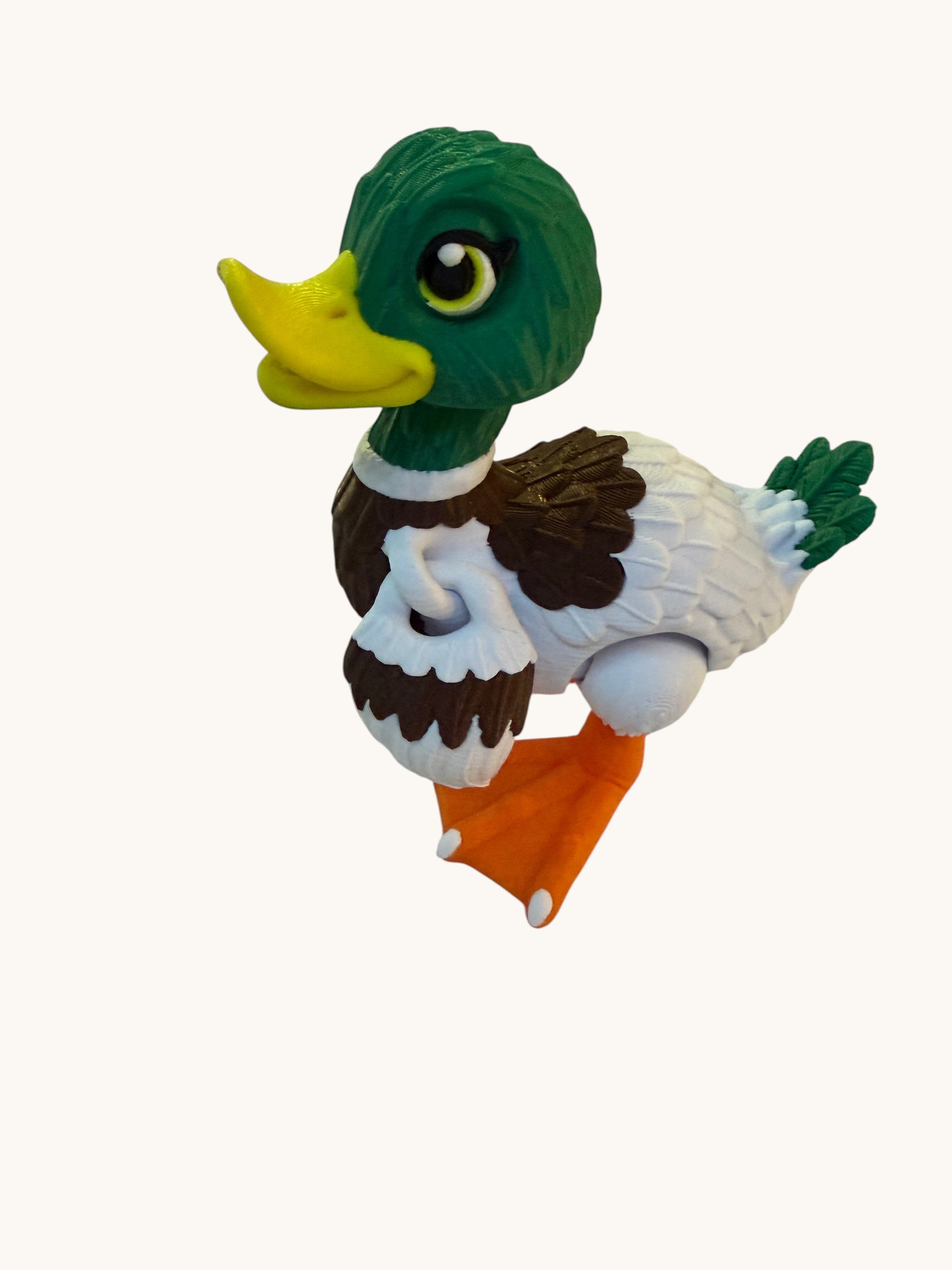 Flutterby Creations 3D duck figurine with green head, yellow beak, white body, brown accents, and orange feet.