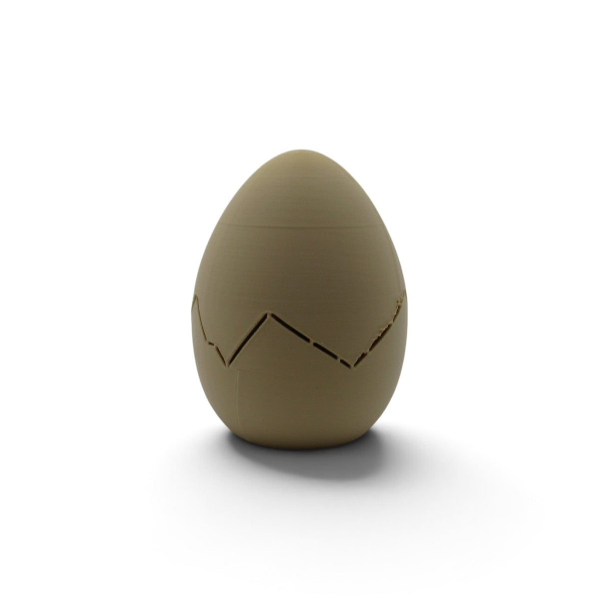 Flutterby Creations 3D printed tan mystery dinosaur egg with a cracked shell design for kids and collectors