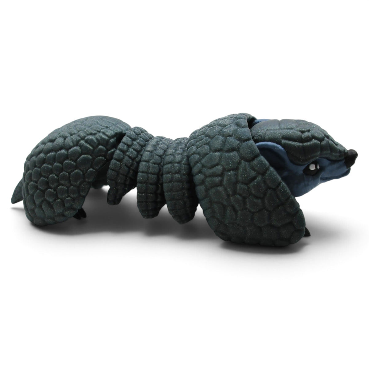 Flutterby Creations Rolo 3D printed flexi armadillo desk toy with detailed dark grey textured armor scales