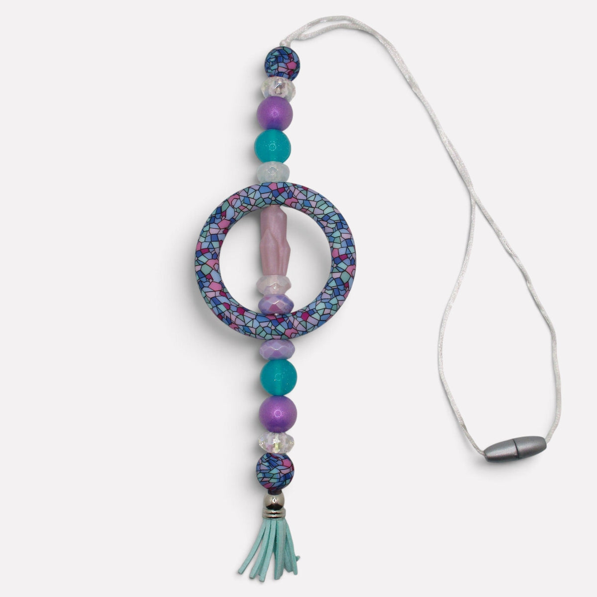 Flutterby Creations handmade beadable car charm featuring purple and teal mosaic beads, a central ring, and a tassel.