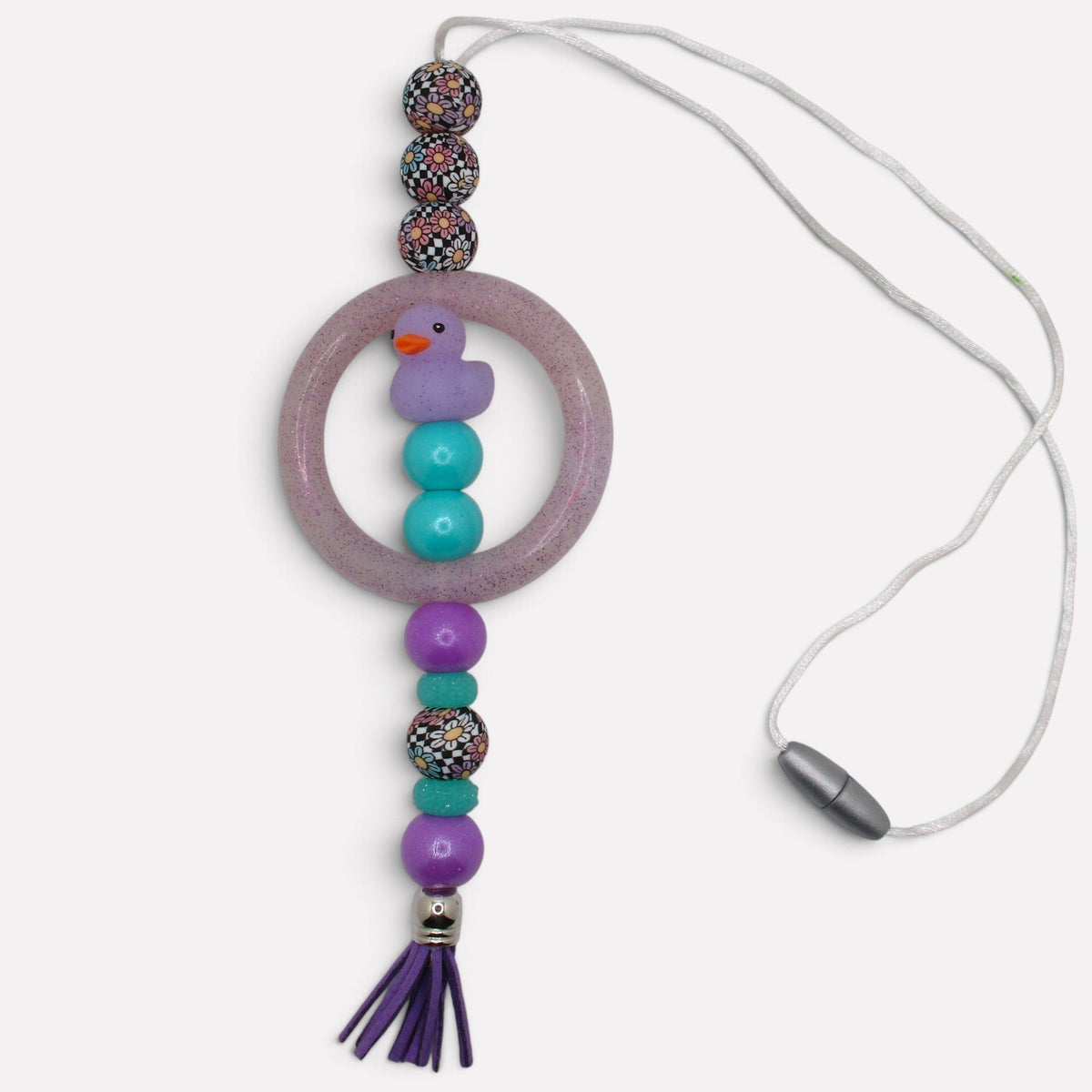 Flutterby Creations handmade beadable car charm featuring a purple duck, glittery ring, and purple tassel.