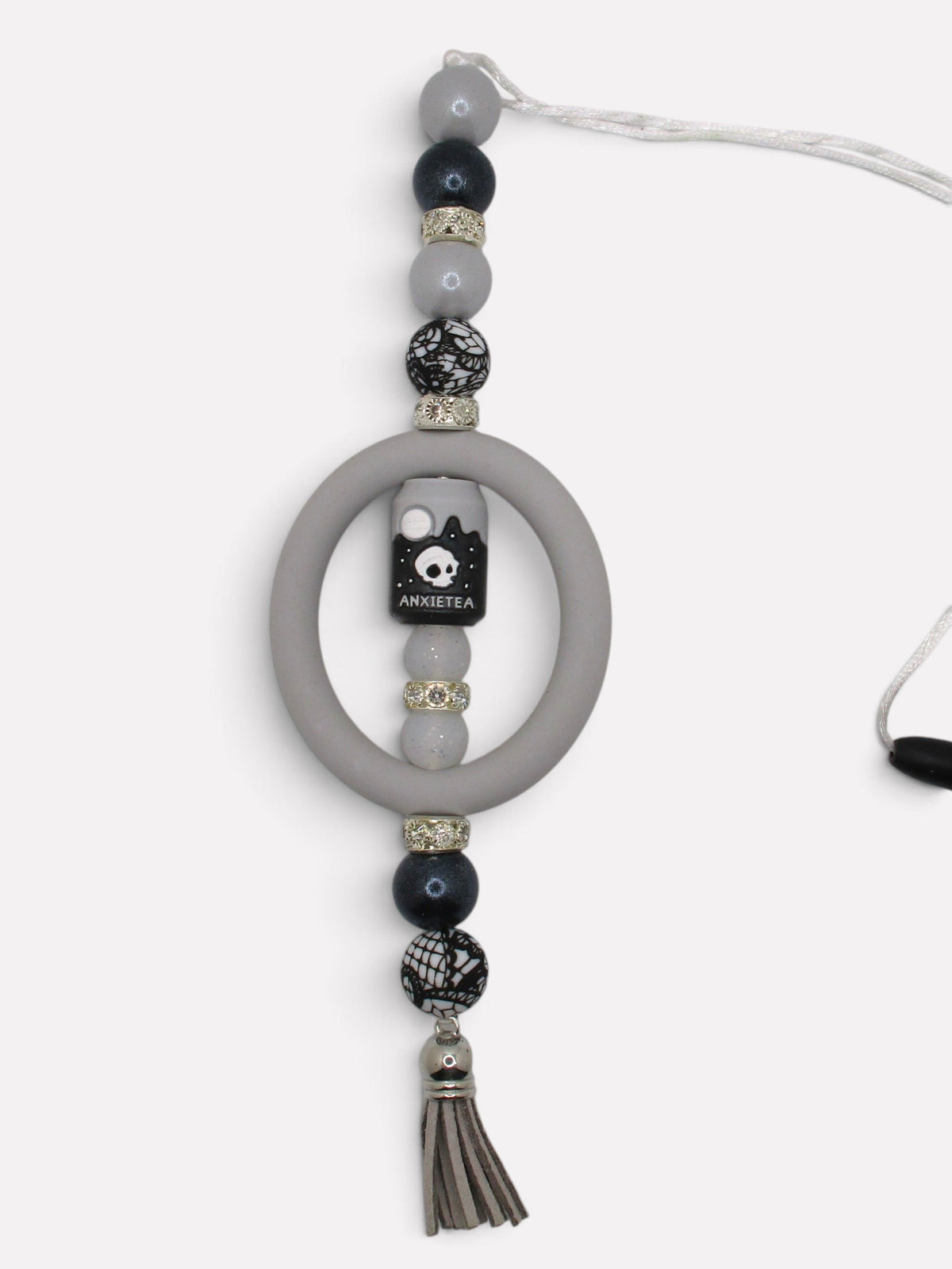 Flutterby Creations handmade beadable car charm with grey beads, skull accent, and tassel for rearview mirror decor.