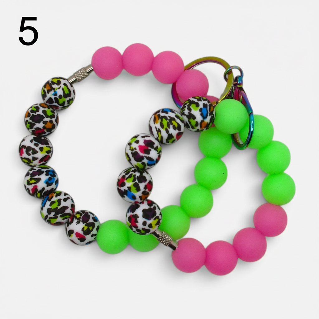 Flutterby Creations beadable wristlet car charms featuring neon pink, lime green, and leopard print silicone beads.