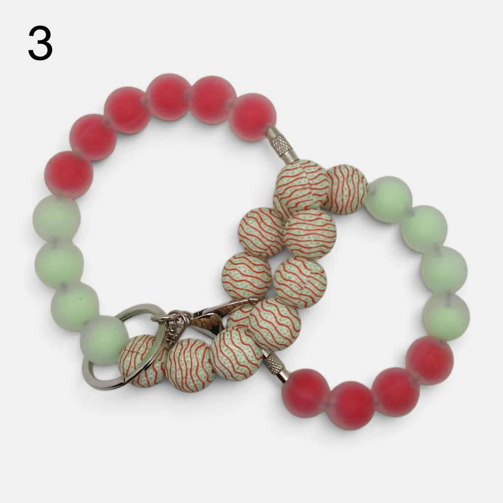 Flutterby Creations beadable wristlet featuring frosted red and light green beads with patterned accent beads