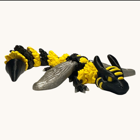 Flutterby Creations Bee Dragon, a 3D-printed fantasy figurine with black and yellow bee-like stripes and segmented body.