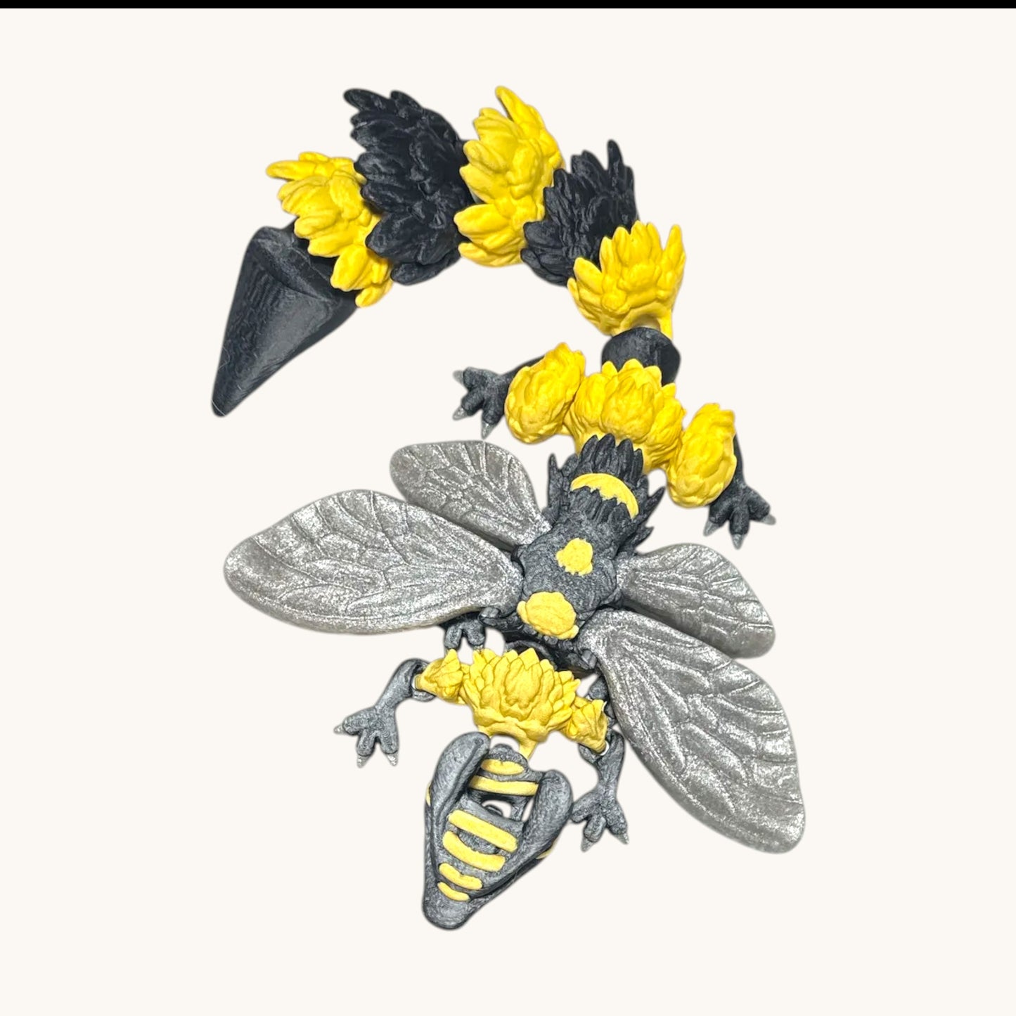 Flutterby Creations 3D printed bee dragon figurine with black and yellow striped body, silver wings, and flower details.
