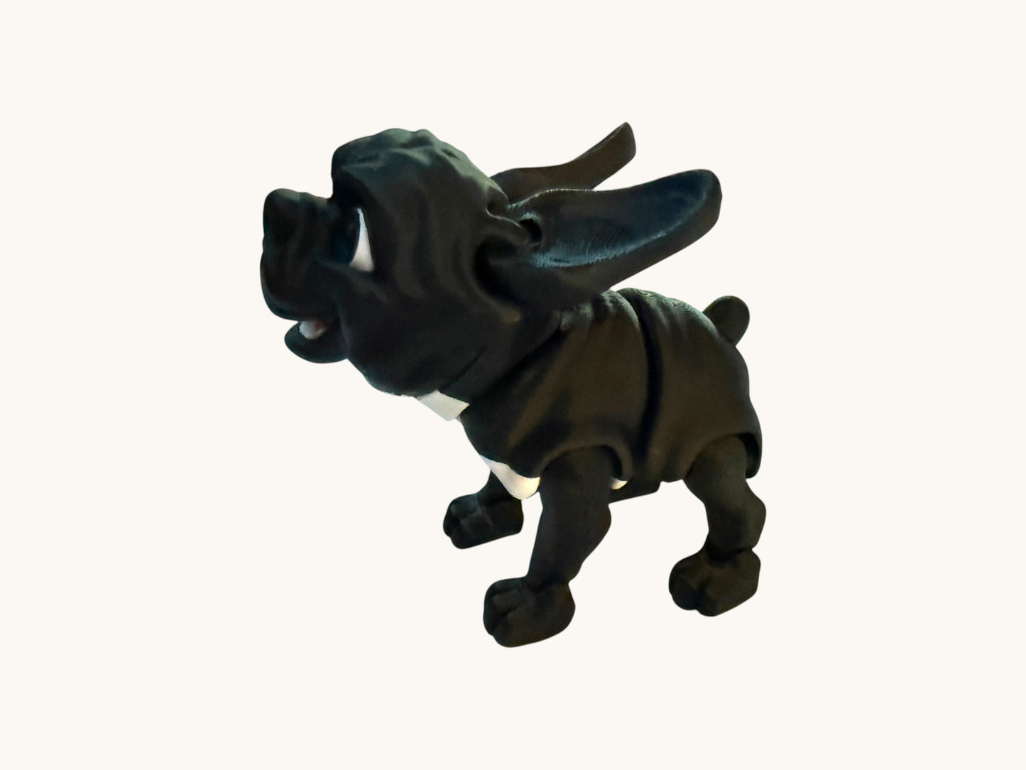 Flutterby Creations black flexible French Bulldog 3D printed toy with white chest detail.