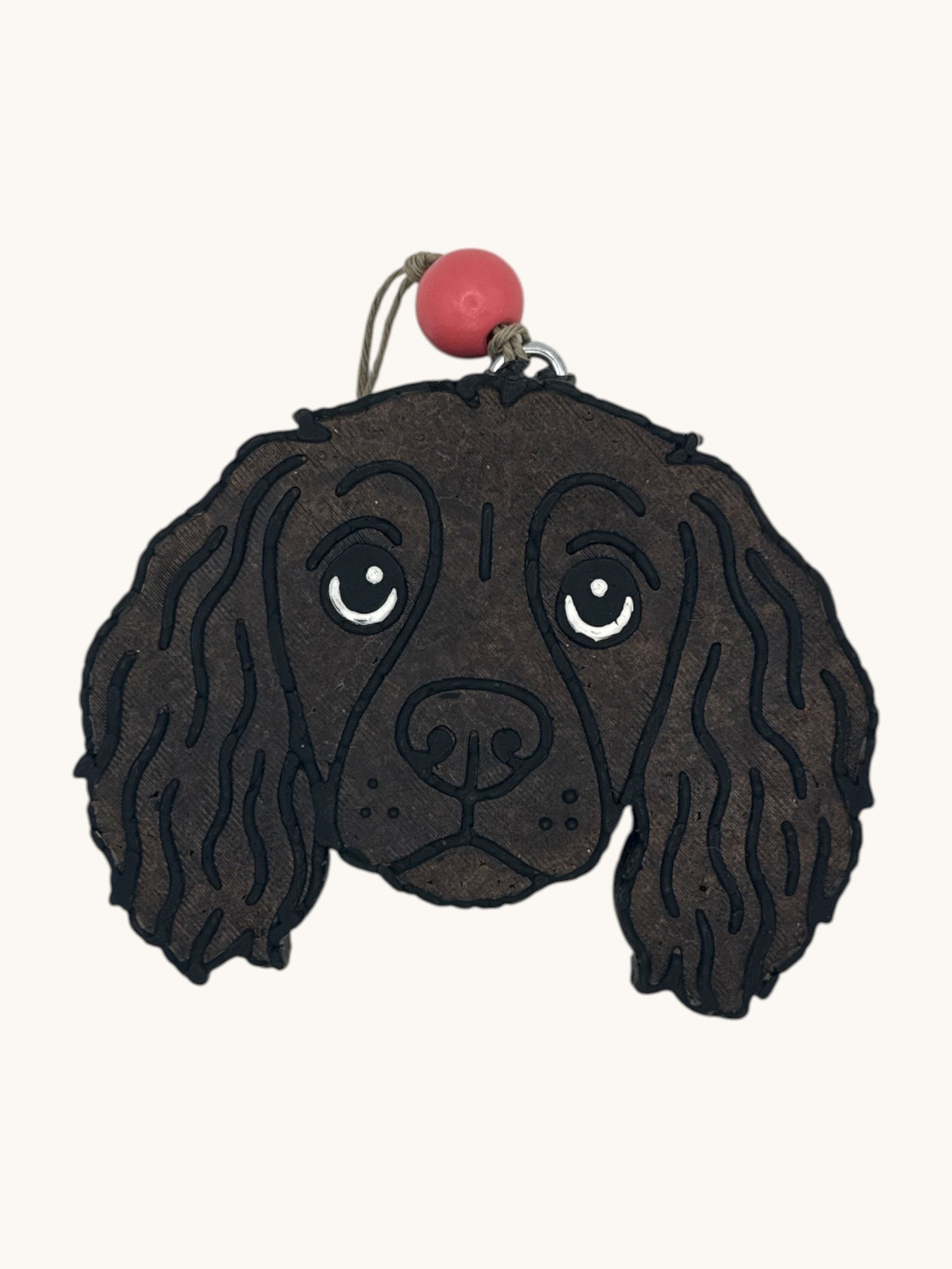 Flutterby Creations Boykin Spaniel dog head car freshie with brown wavy fur and pink bead accent.