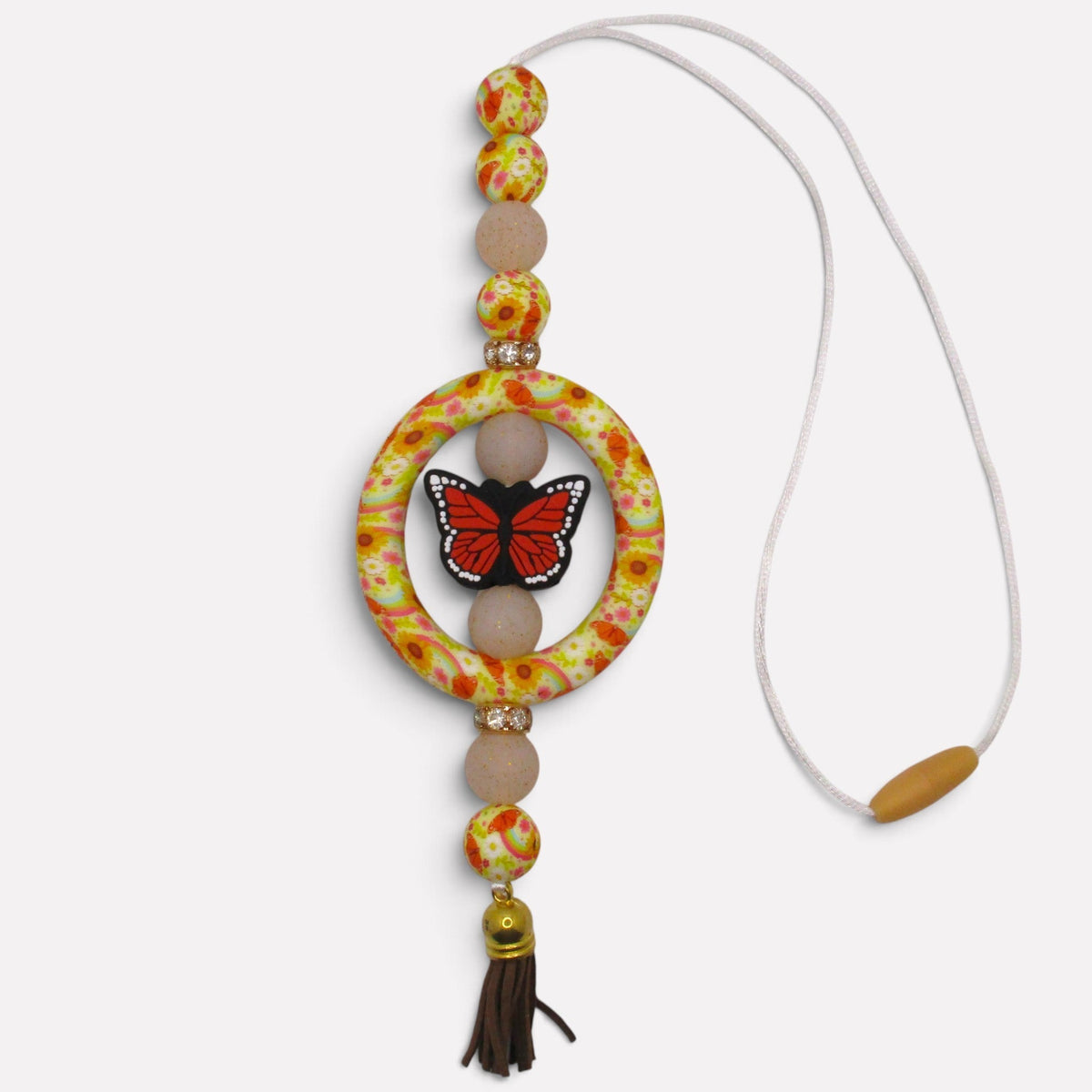 Flutterby Creations handmade beadable car charm featuring a butterfly, floral beads, and a brown tassel.