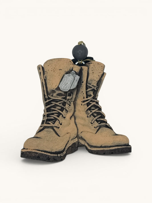 Flutterby Creations 3D combat boots freshie with dog tags and a black ball charm, tan color.