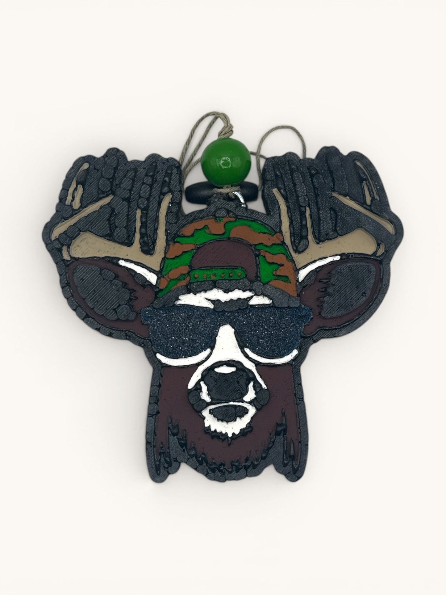 Flutterby Creations Cool Buck car air freshener, a deer head with sunglasses and camo cap.