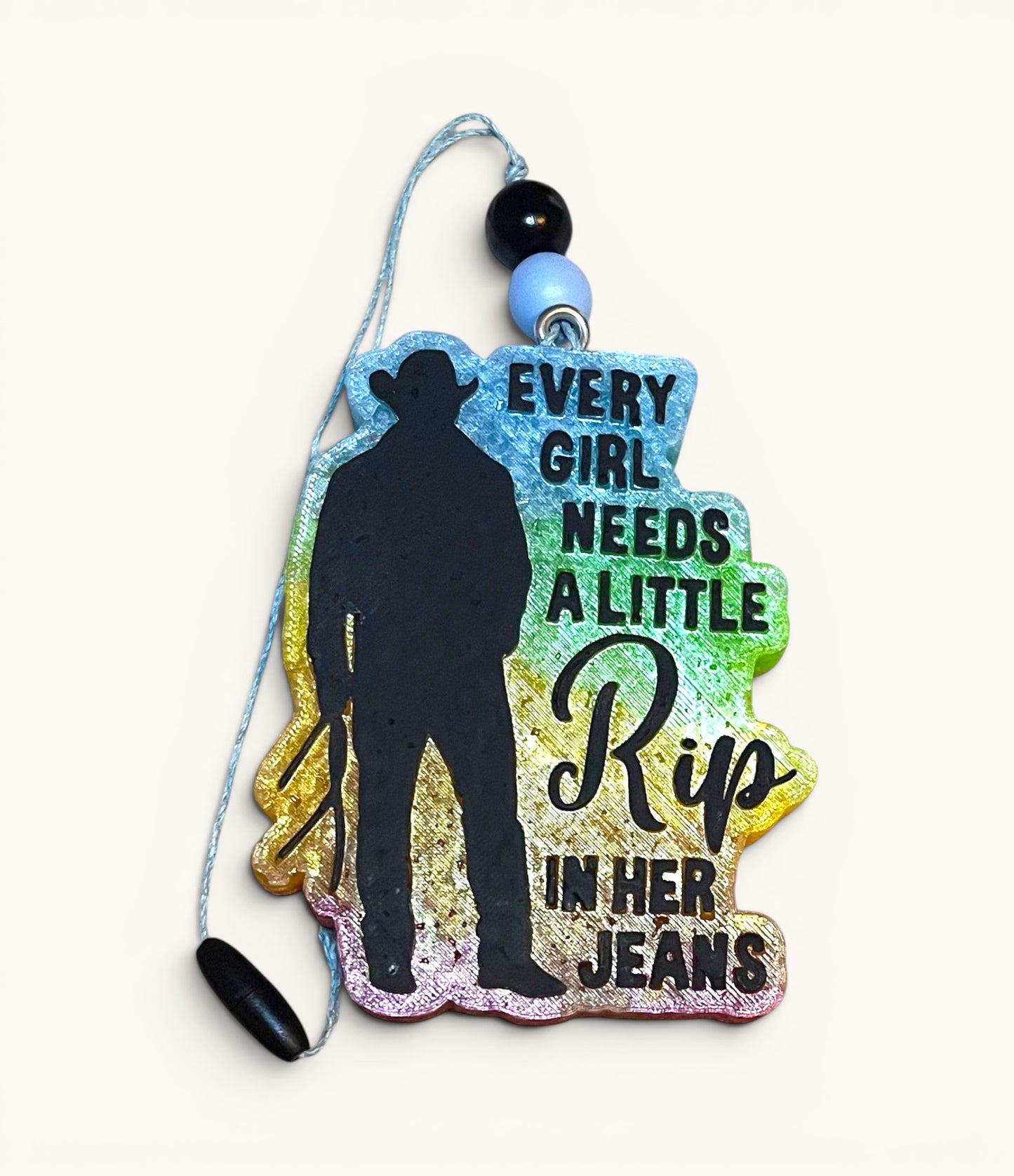 Flutterby Creations air freshener with cowboy silhouette and "Every girl needs a little Rip in her jeans" text.