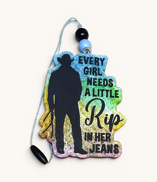 Flutterby Creations air freshener with cowboy silhouette and "Every girl needs a little Rip in her jeans" text.