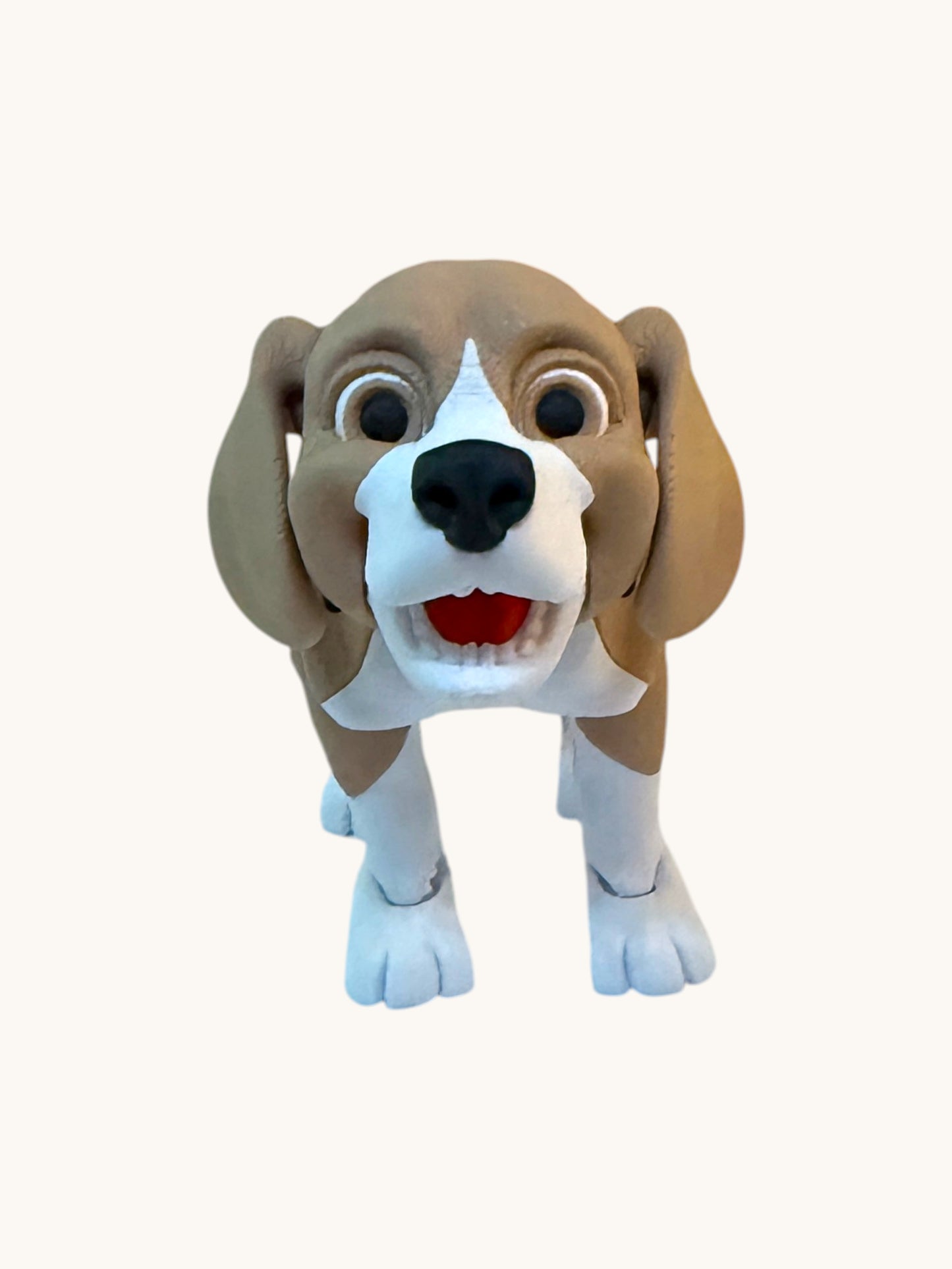 Flutterby Creations flexible beagle dog figurine with brown and white markings, black nose, and wide eyes.