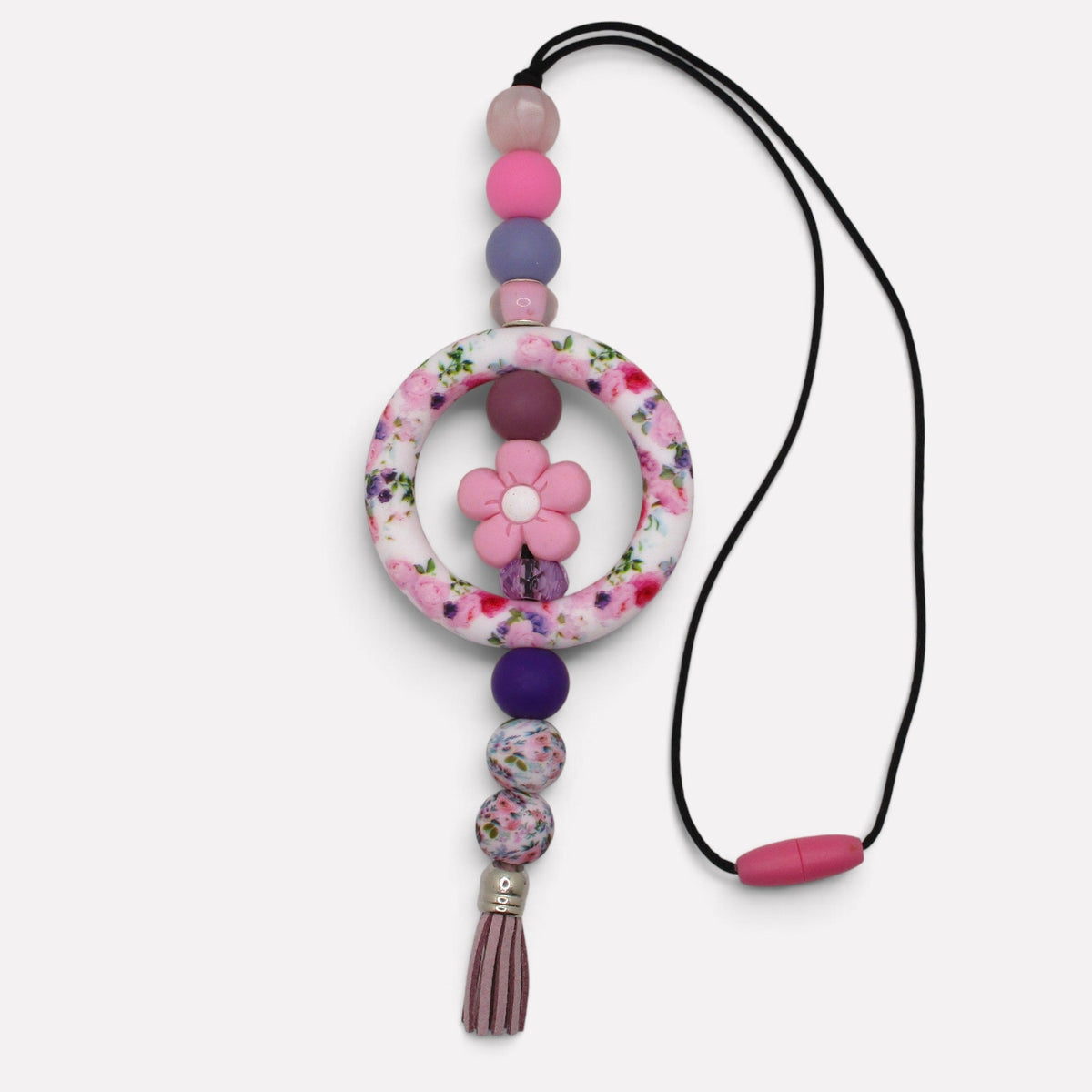 Flutterby Creations handmade beadable car charm featuring a floral ring, pink flower accent, and purple tassel.