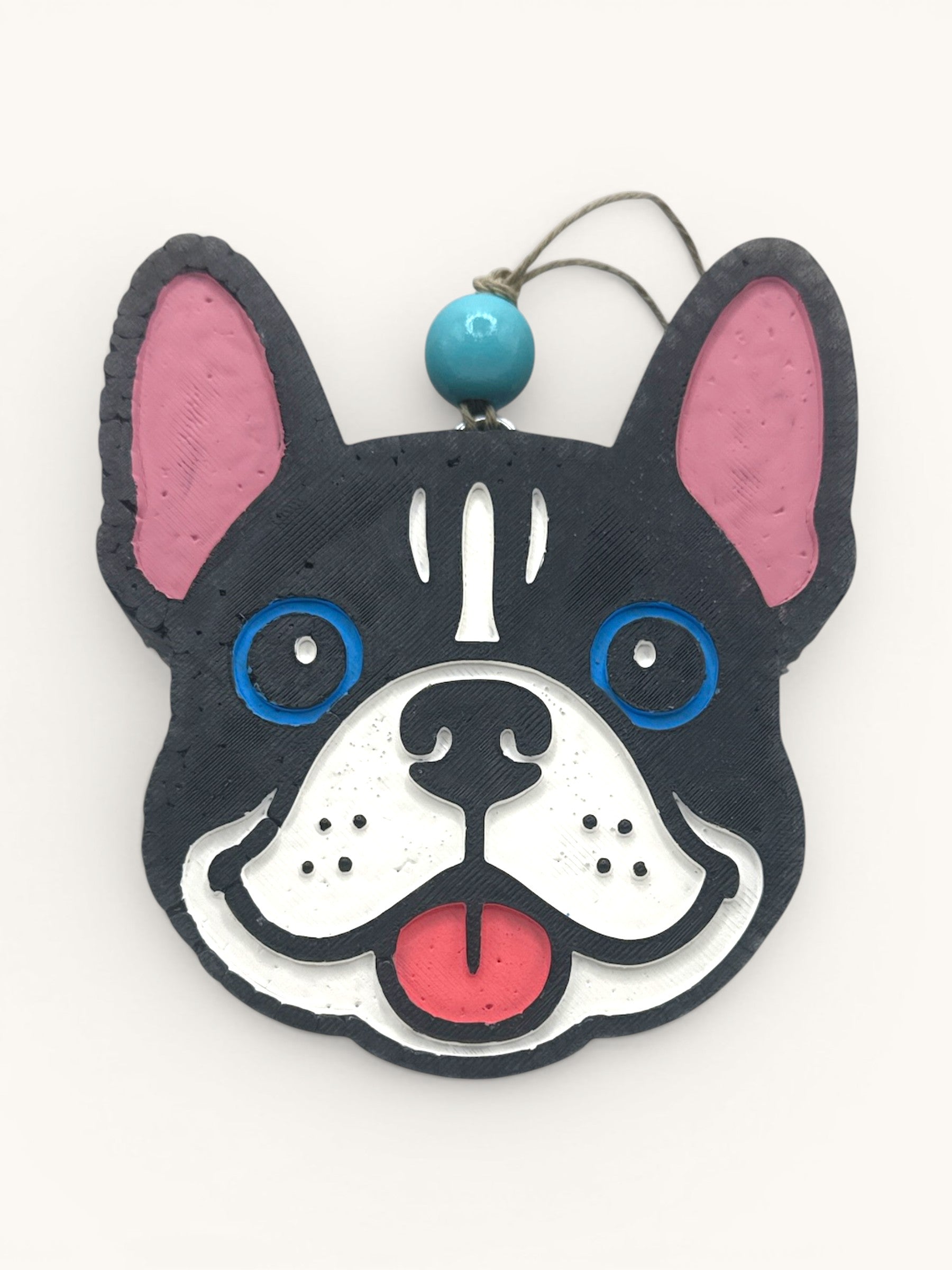 Flutterby Creations French bulldog car freshie with black, white, blue, and pink details. Features a blue bead and hanging string.