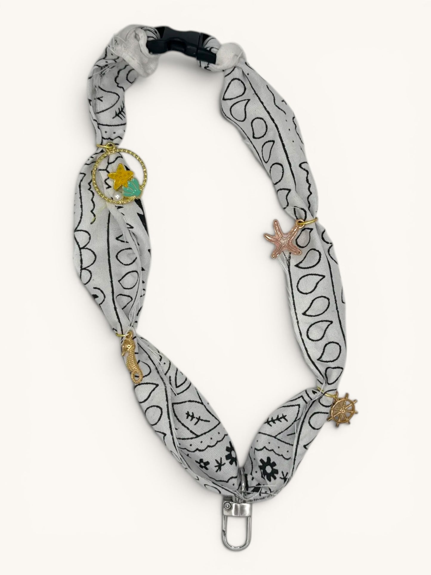 Flutterby Creations Freshie Hangers with clasp, featuring a grey bandana print fabric and nautical charms like a seahorse, starfish, and ship wheel.