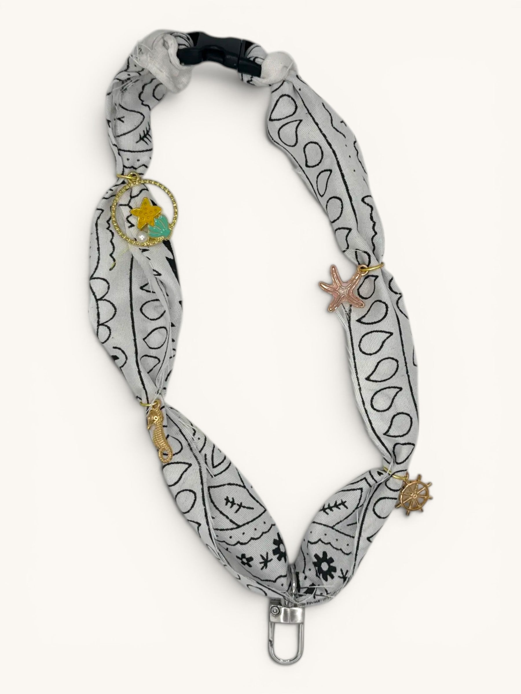 Flutterby Creations Freshie Hangers with clasp, featuring a grey bandana print fabric and nautical charms like a seahorse, starfish, and ship wheel.