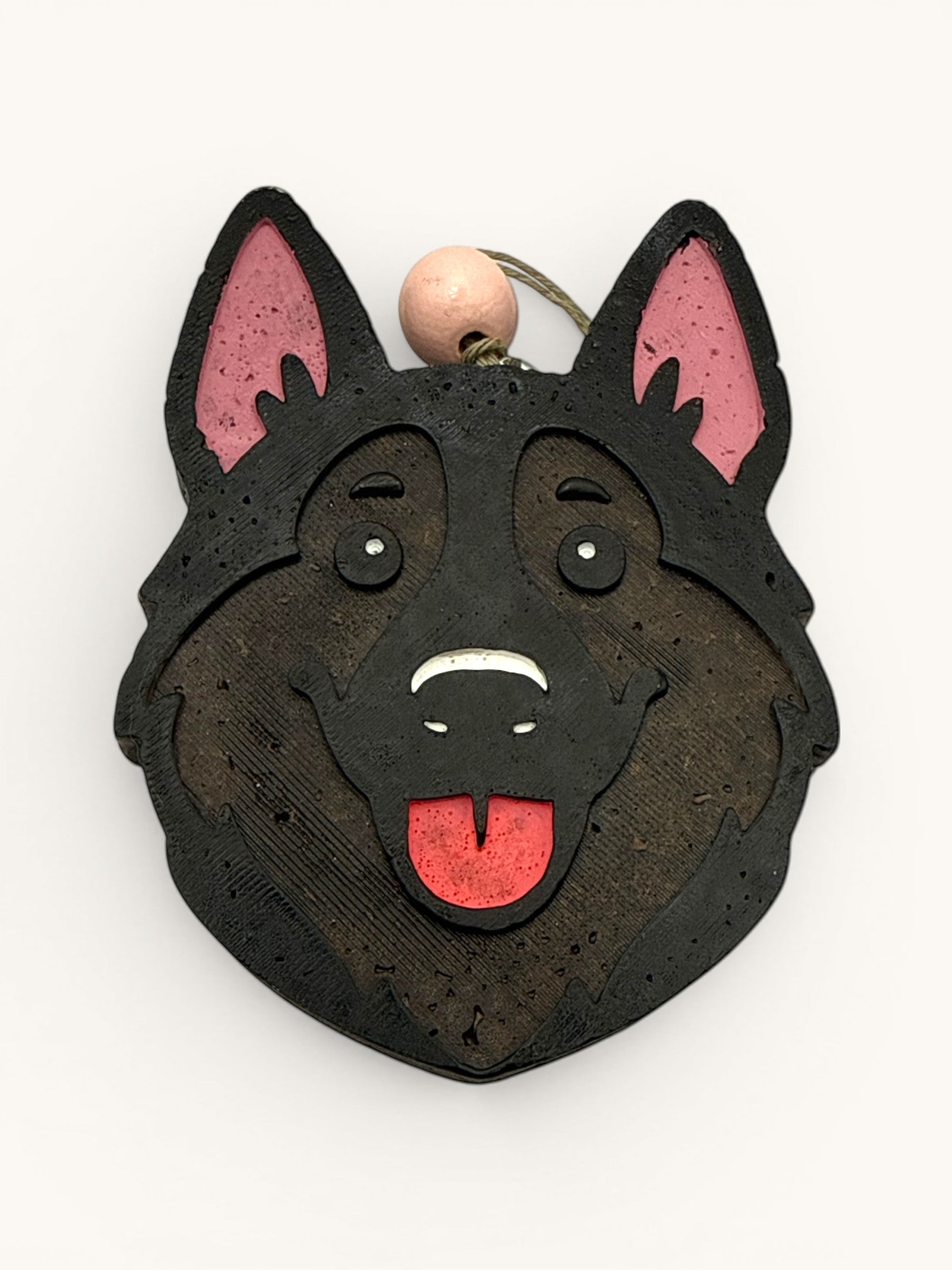 Flutterby Creations German Shepherd car air freshener, black with pink inner ears and red tongue.
