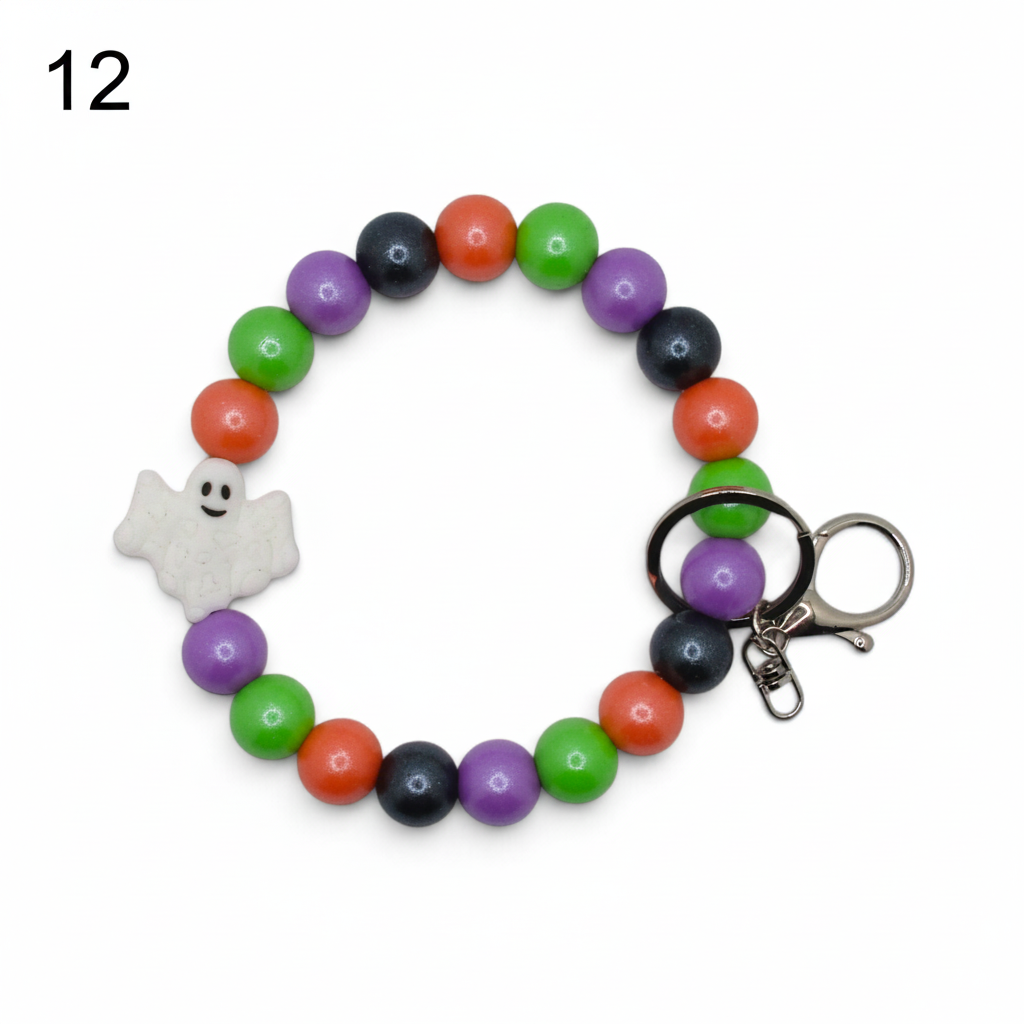 Flutterby Creations beadable wristlet featuring colorful Halloween beads and a cute white ghost charm for car decor.