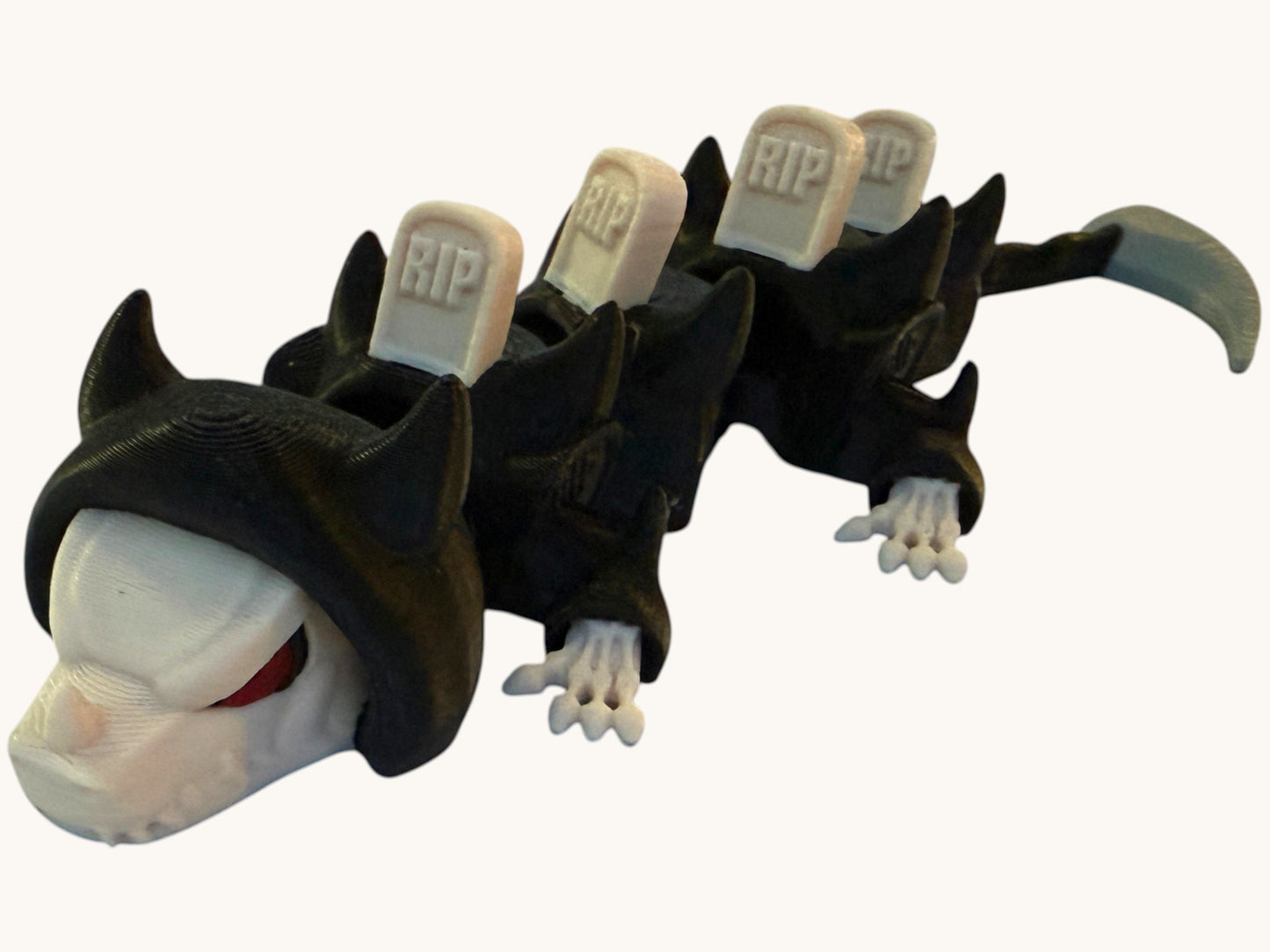 Flutterby Creations Mini Reaper Dragon figurine with RIP headstones on its back and a scythe tail.
