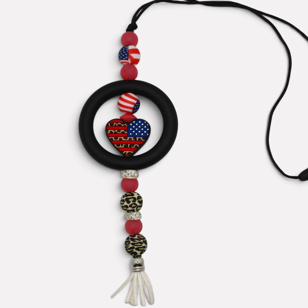 Flutterby Creations handmade beadable car charm featuring a patriotic heart, leopard print beads, and a white tassel.