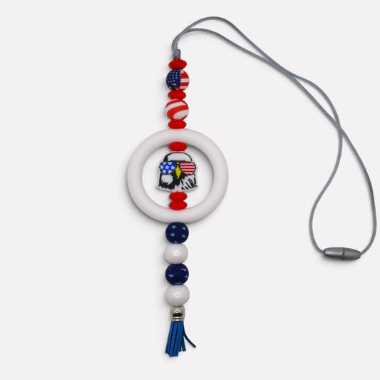Flutterby Creations handmade beadable car charm featuring a patriotic eagle, red, white, and blue beads, and a tassel.