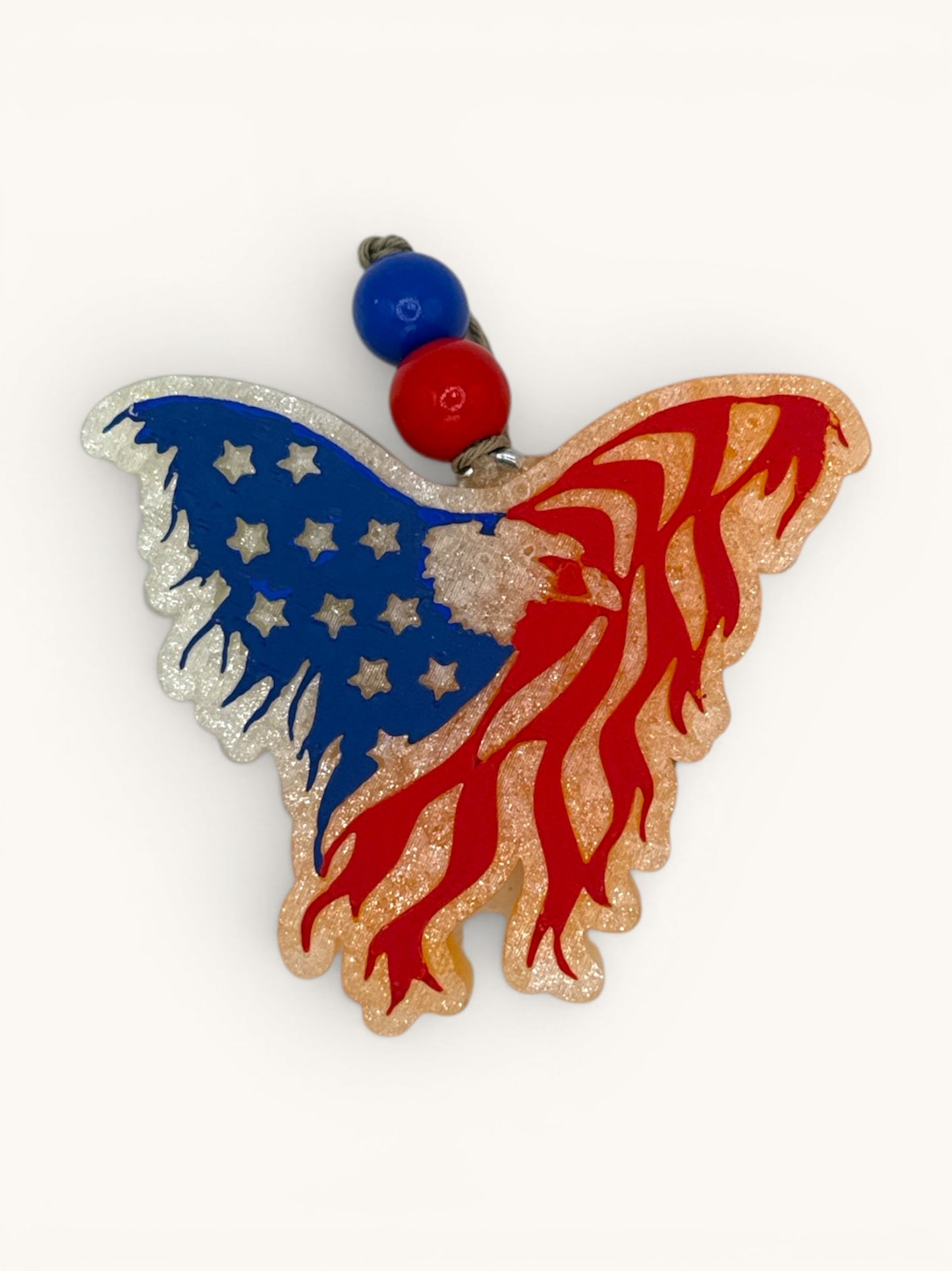 Flutterby Creations patriotic eagle-shaped car freshie with American flag design, red, white, and blue glitter accents.