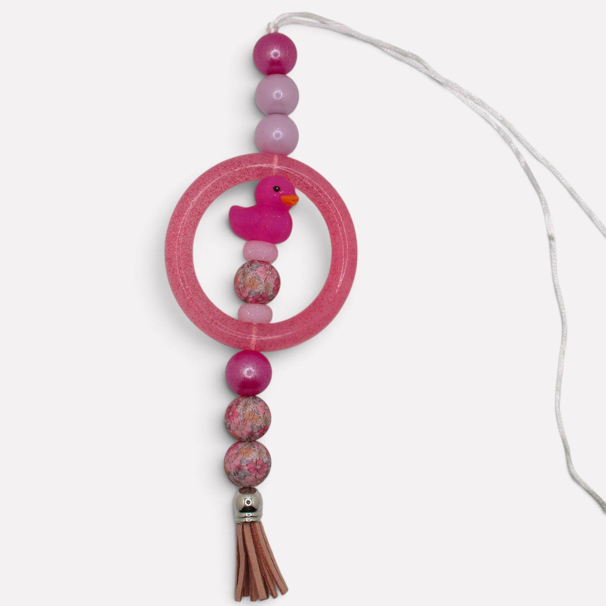 Flutterby Creations handmade pink beadable car charm featuring a glittery ring, floral beads, and a cute rubber duck.