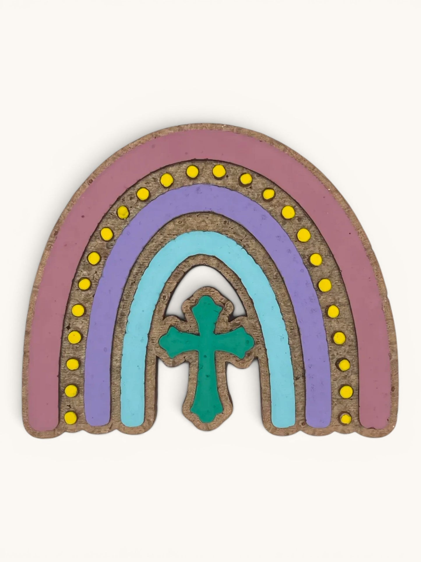 Flutterby Creations Rainbow Cross car freshie, handmade with aroma beads. Features pastel rainbow layers and a teal cross.