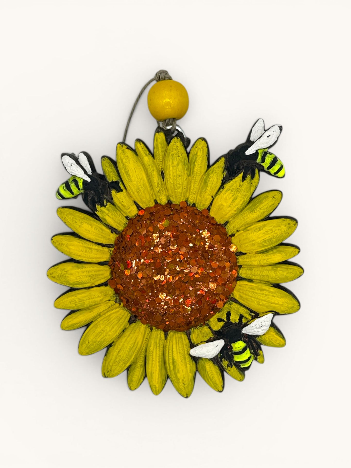 Flutterby Creations 3D sunflower car freshie with glittery brown center and bees on yellow petals.