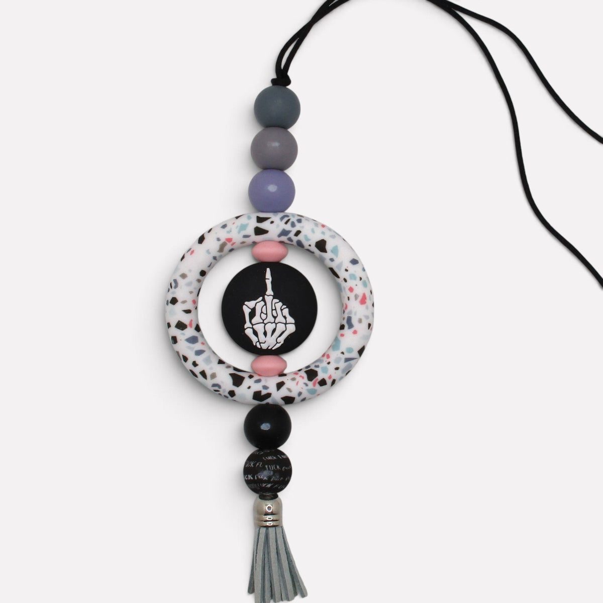 Flutterby Creations handmade car charm featuring a terrazzo ring, skeleton hand graphic, and grey tassel.