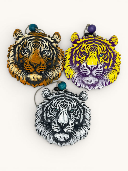 Flutterby Creations 3D tiger freshies in orange, yellow/purple, and black/white. Detailed, textured, and dimensional car air fresheners.